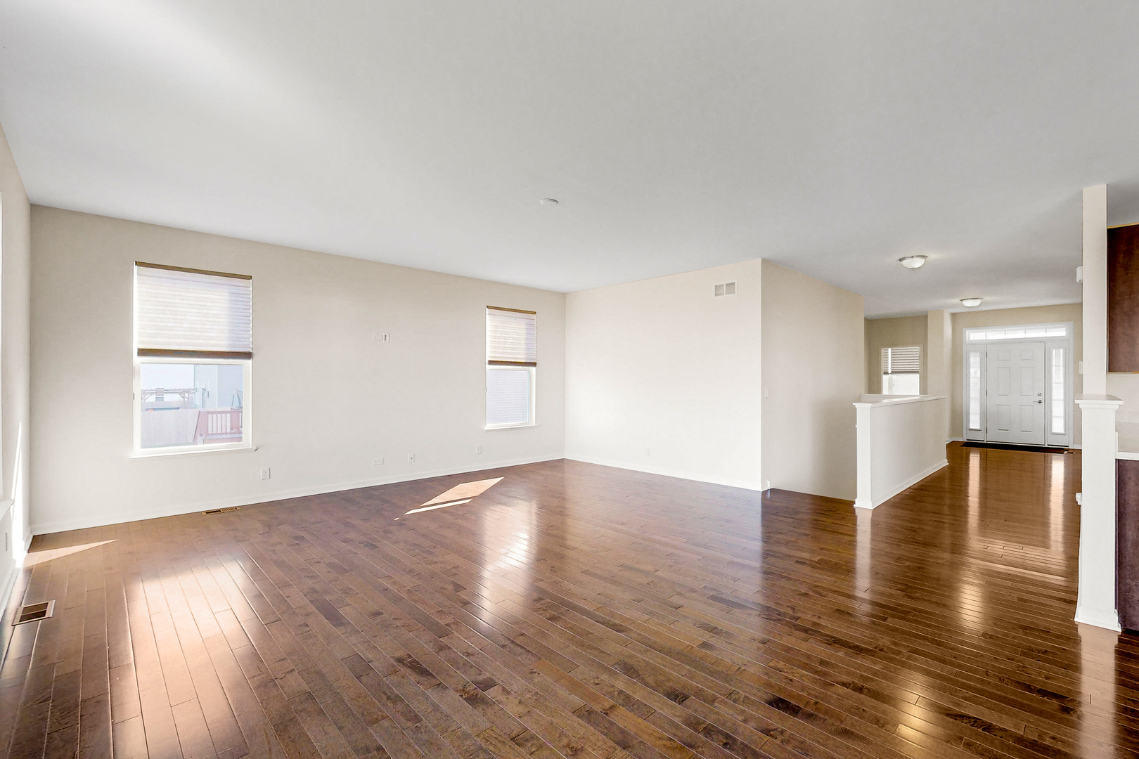 731 Windett Ridge Road Yorkville, IL 60560 - Photo 16 of 28 a view of an empty room with window and wooden floor