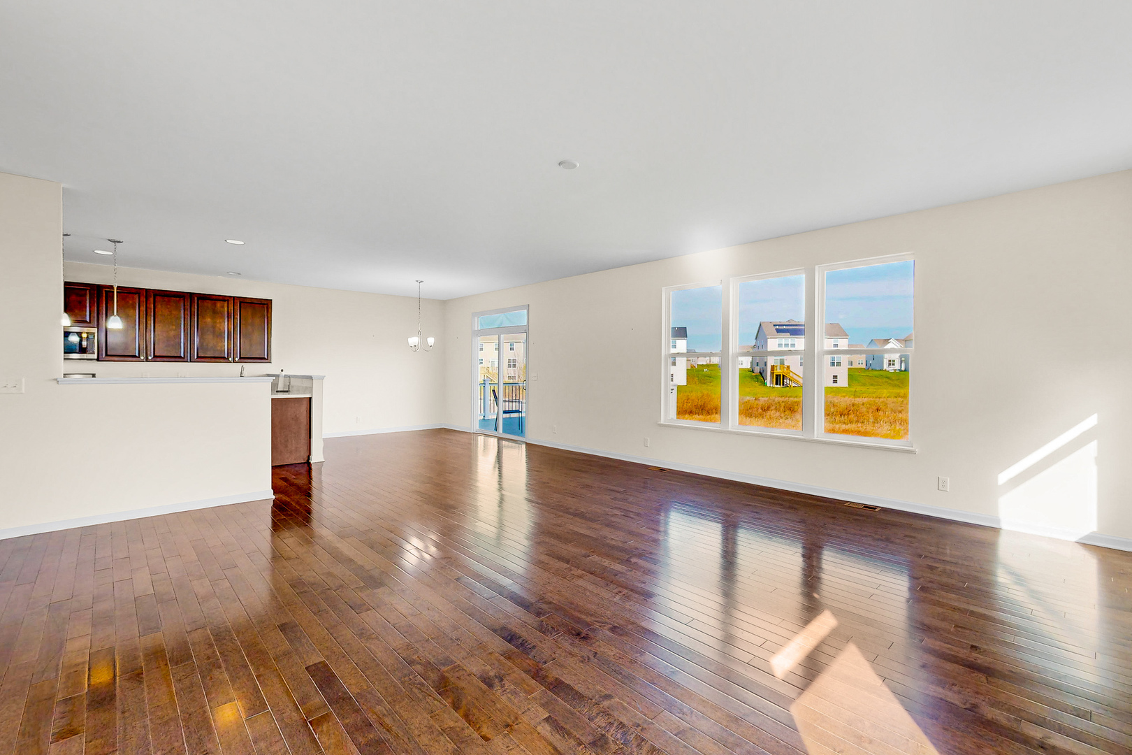 731 Windett Ridge Road Yorkville, IL 60560 - Photo 6 of 28 a view of a livingroom with wooden floor
