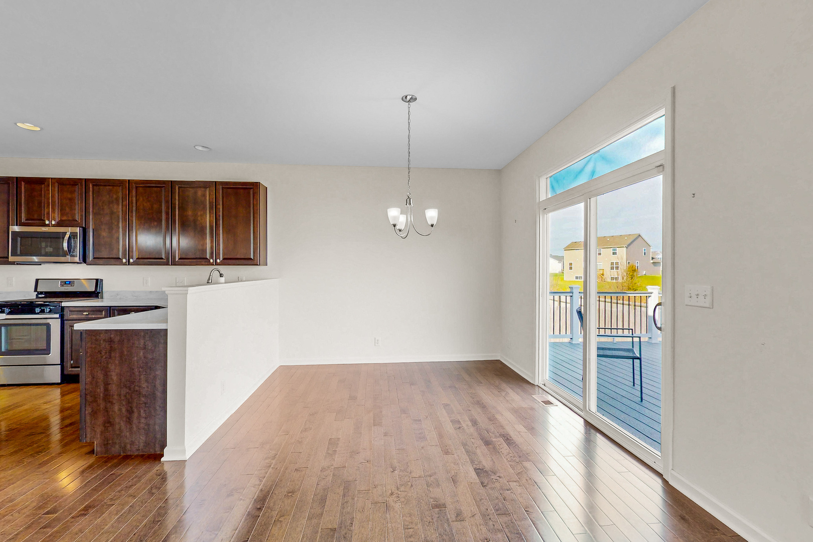 731 Windett Ridge Road Yorkville, IL 60560 - Photo 8 of 28 a view of a kitchen from the hallway