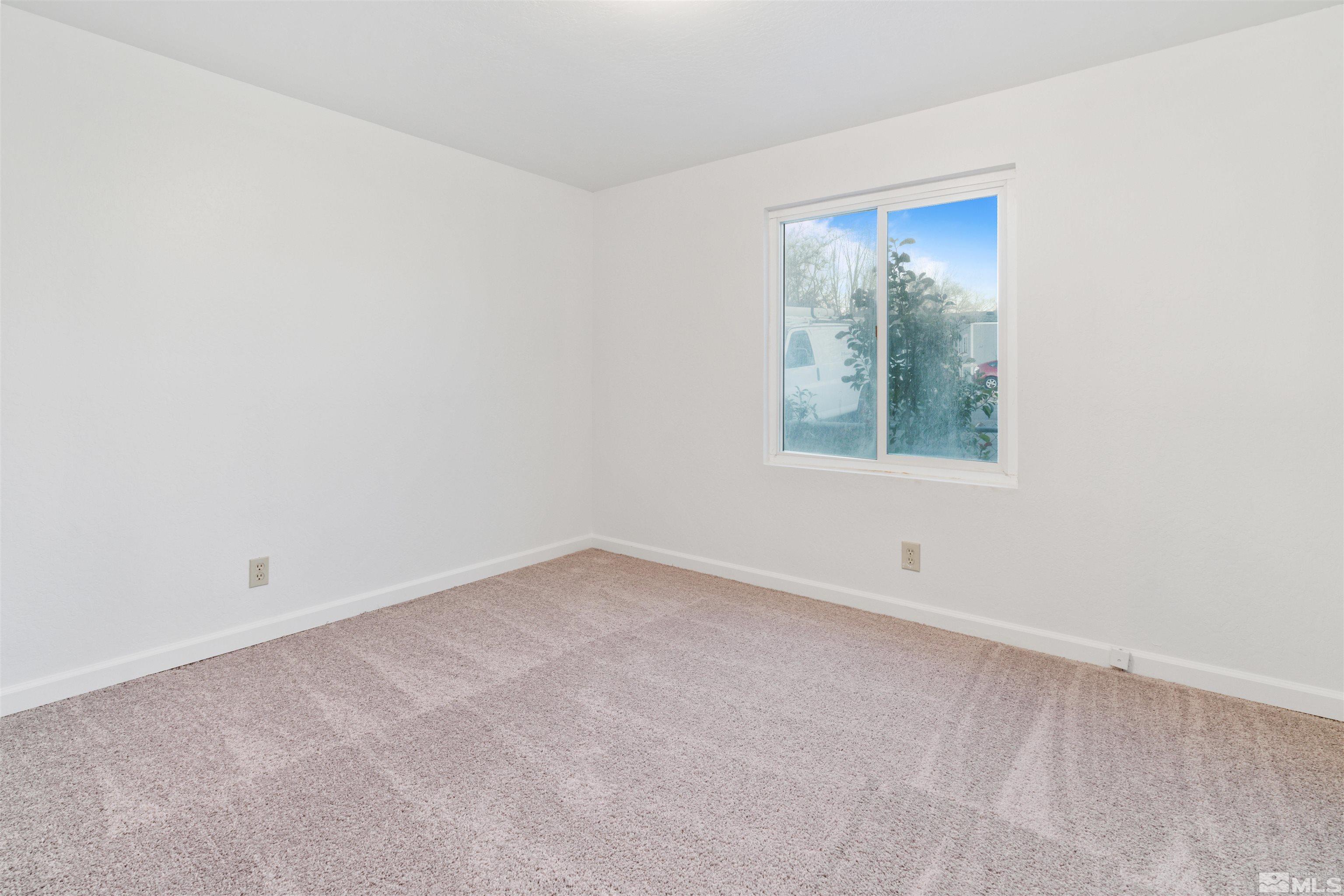 210 Zircon Drive Reno, NV 89521 - Photo 14 of 35 an empty room with a window