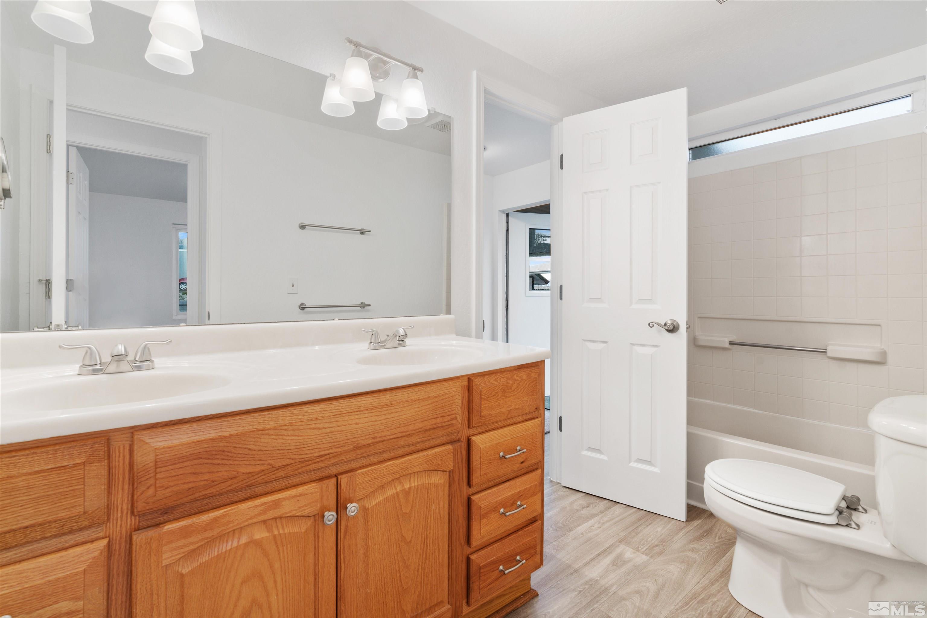 210 Zircon Drive Reno, NV 89521 - Photo 16 of 35 a bathroom with a sink a toilet and shower