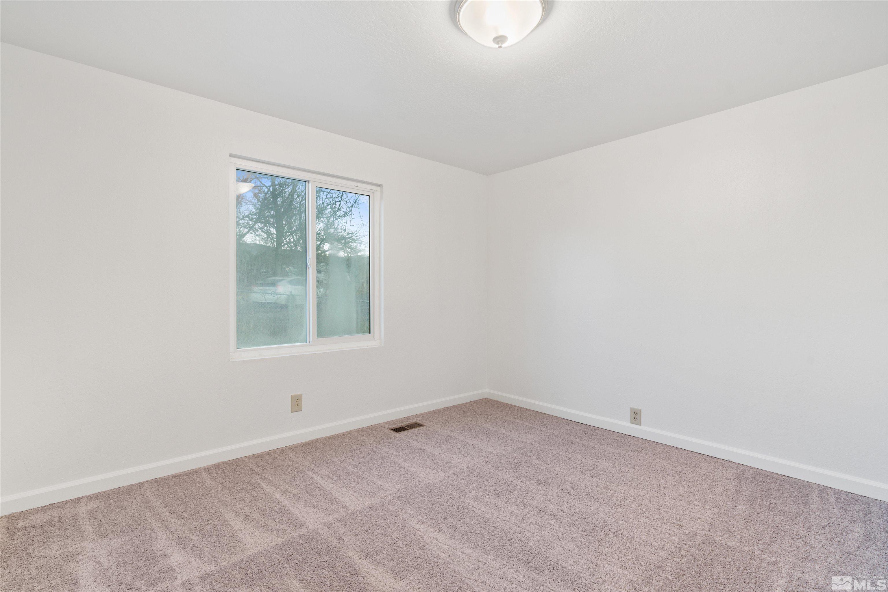 210 Zircon Drive Reno, NV 89521 - Photo 17 of 35 an empty room with a window