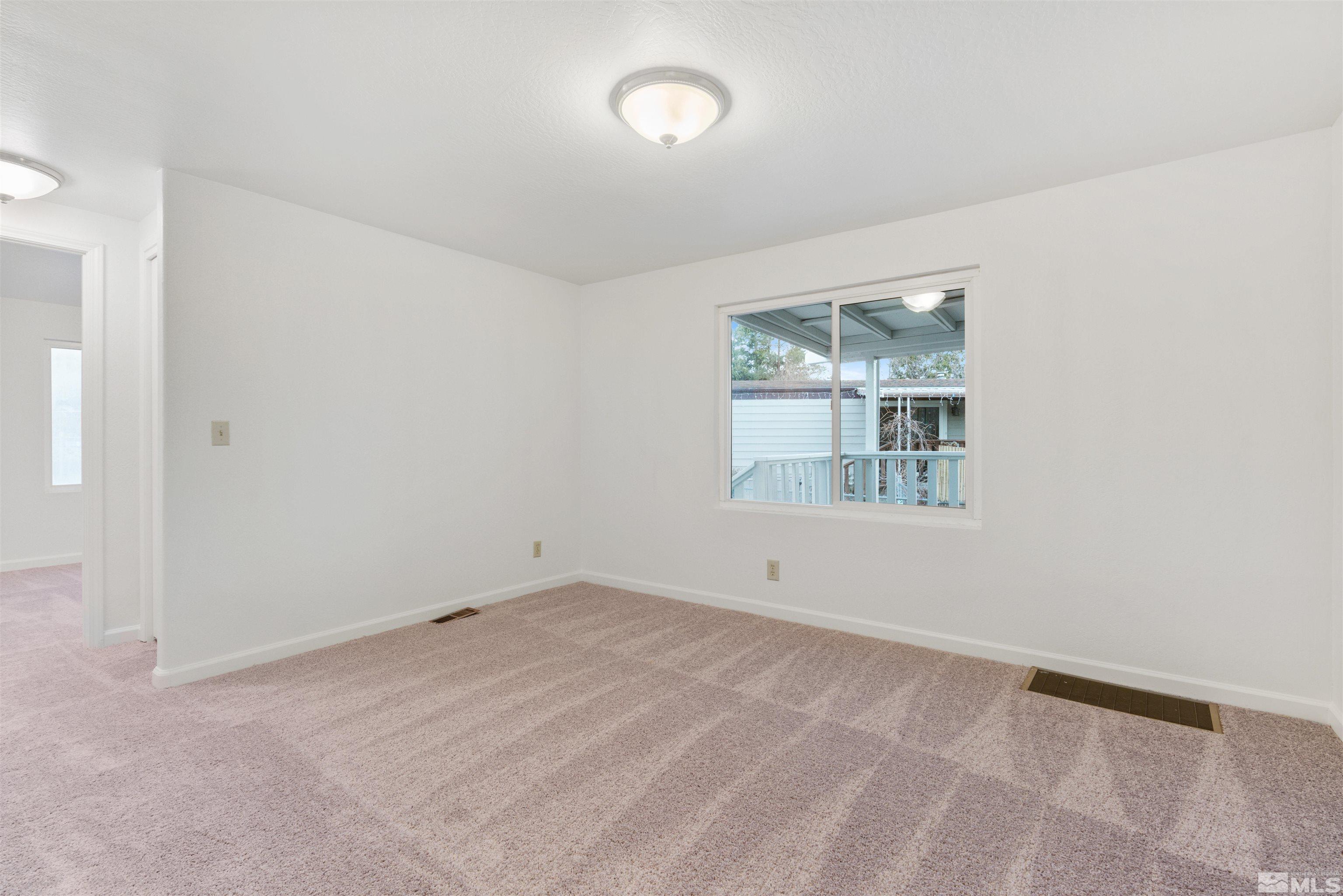 210 Zircon Drive Reno, NV 89521 - Photo 19 of 35 an empty room with a window