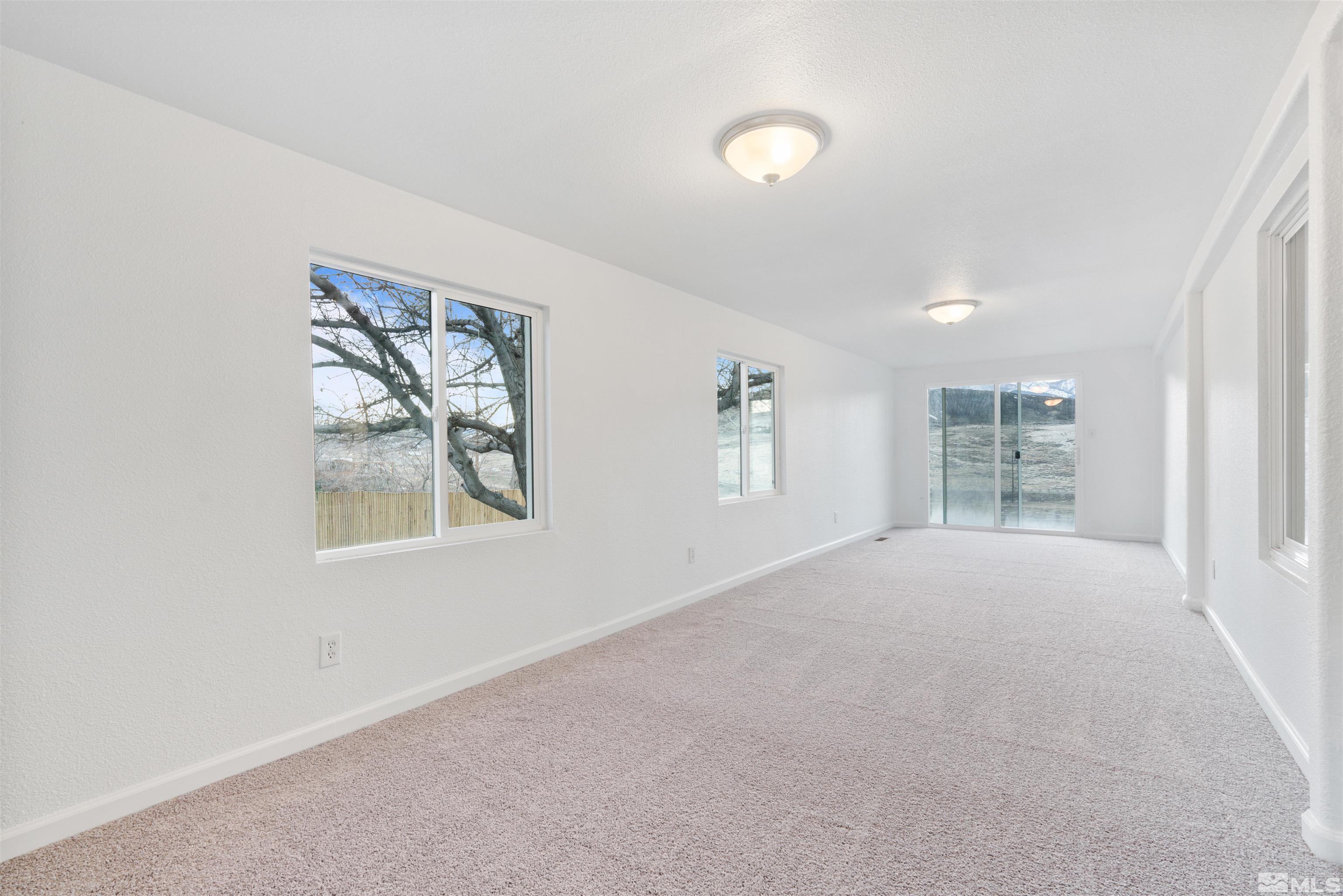 210 Zircon Drive Reno, NV 89521 - Photo 22 of 35 an empty room with windows and closet