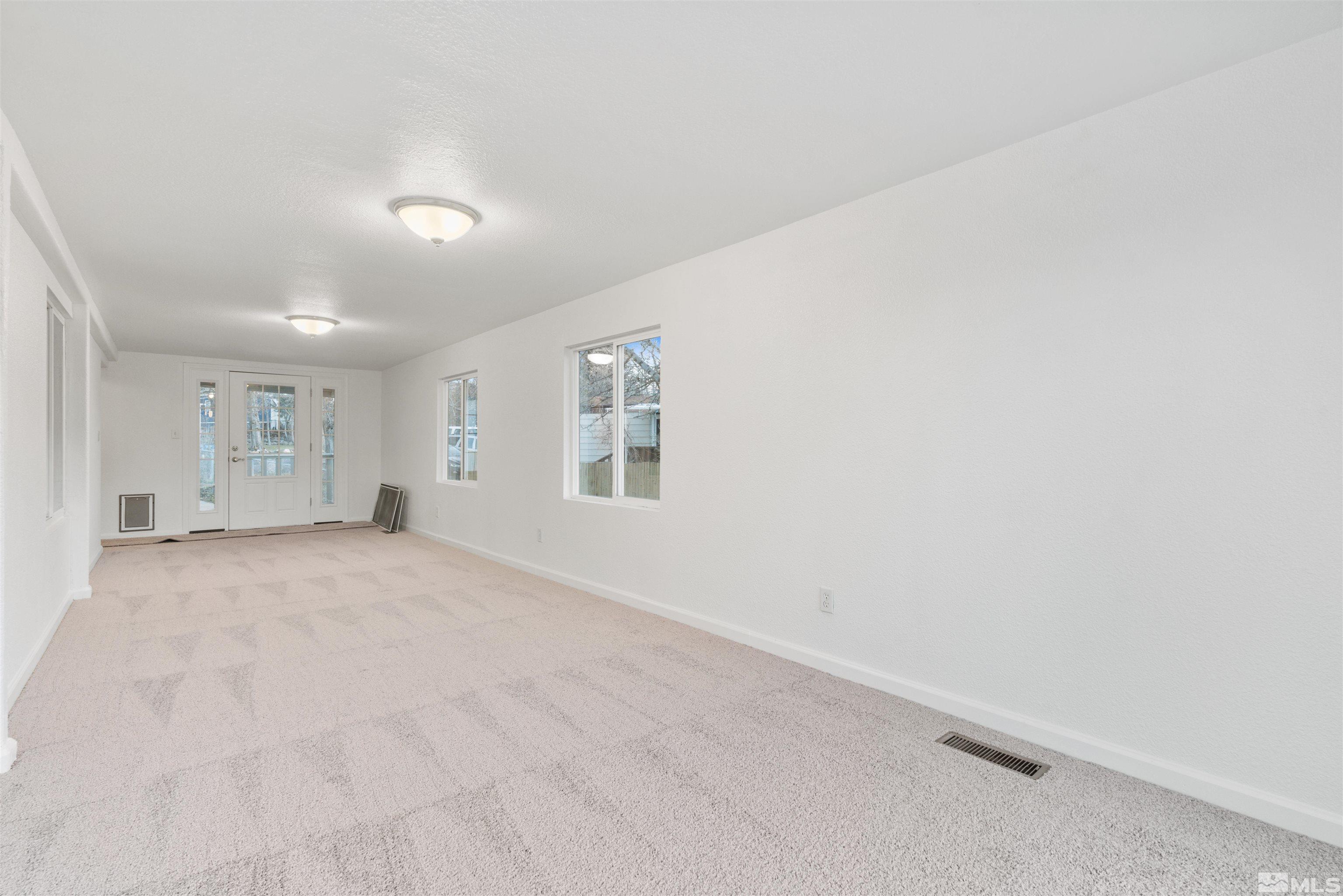 210 Zircon Drive Reno, NV 89521 - Photo 23 of 35 an empty room with windows