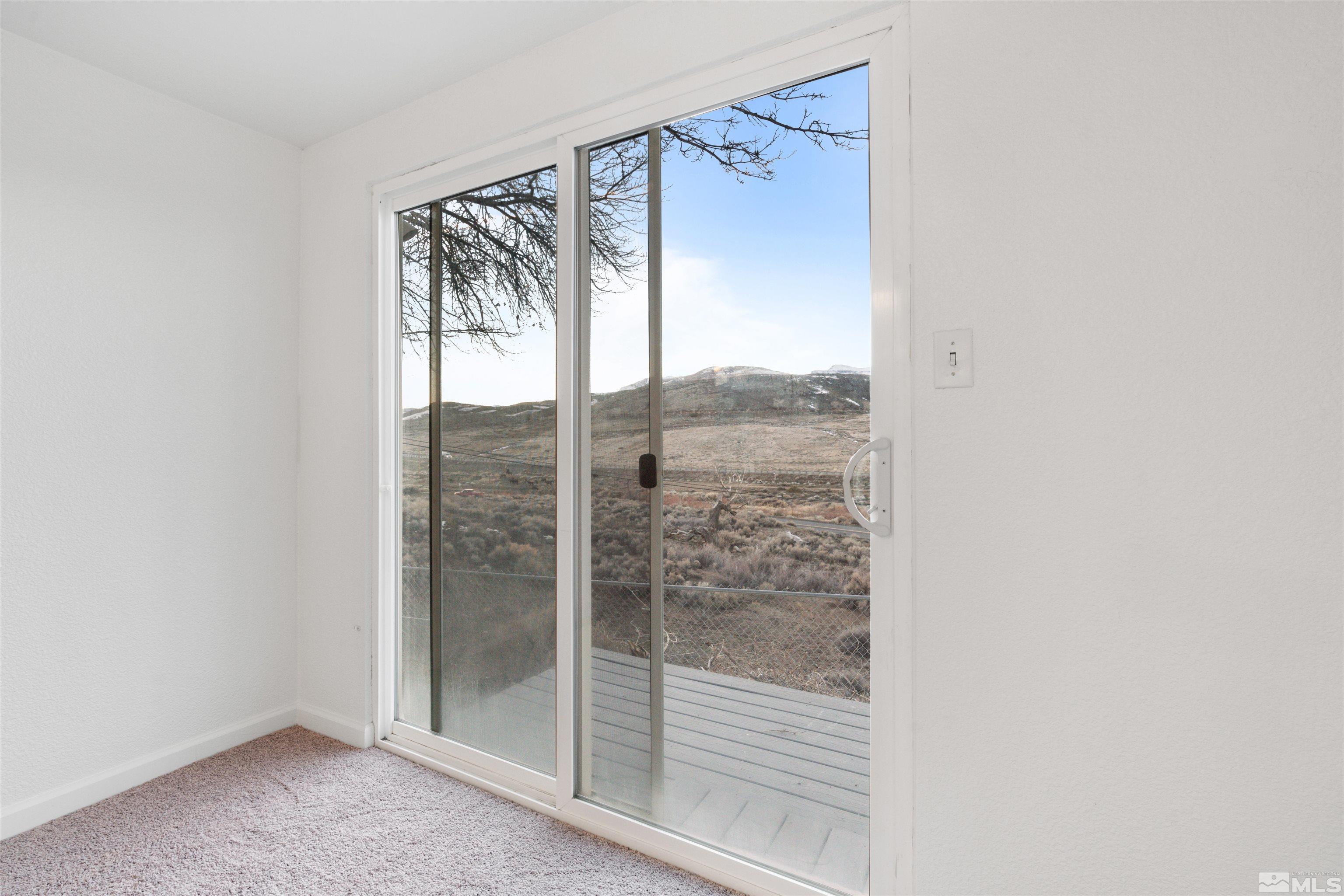 210 Zircon Drive Reno, NV 89521 - Photo 24 of 35 a view of a glass door with a glass door