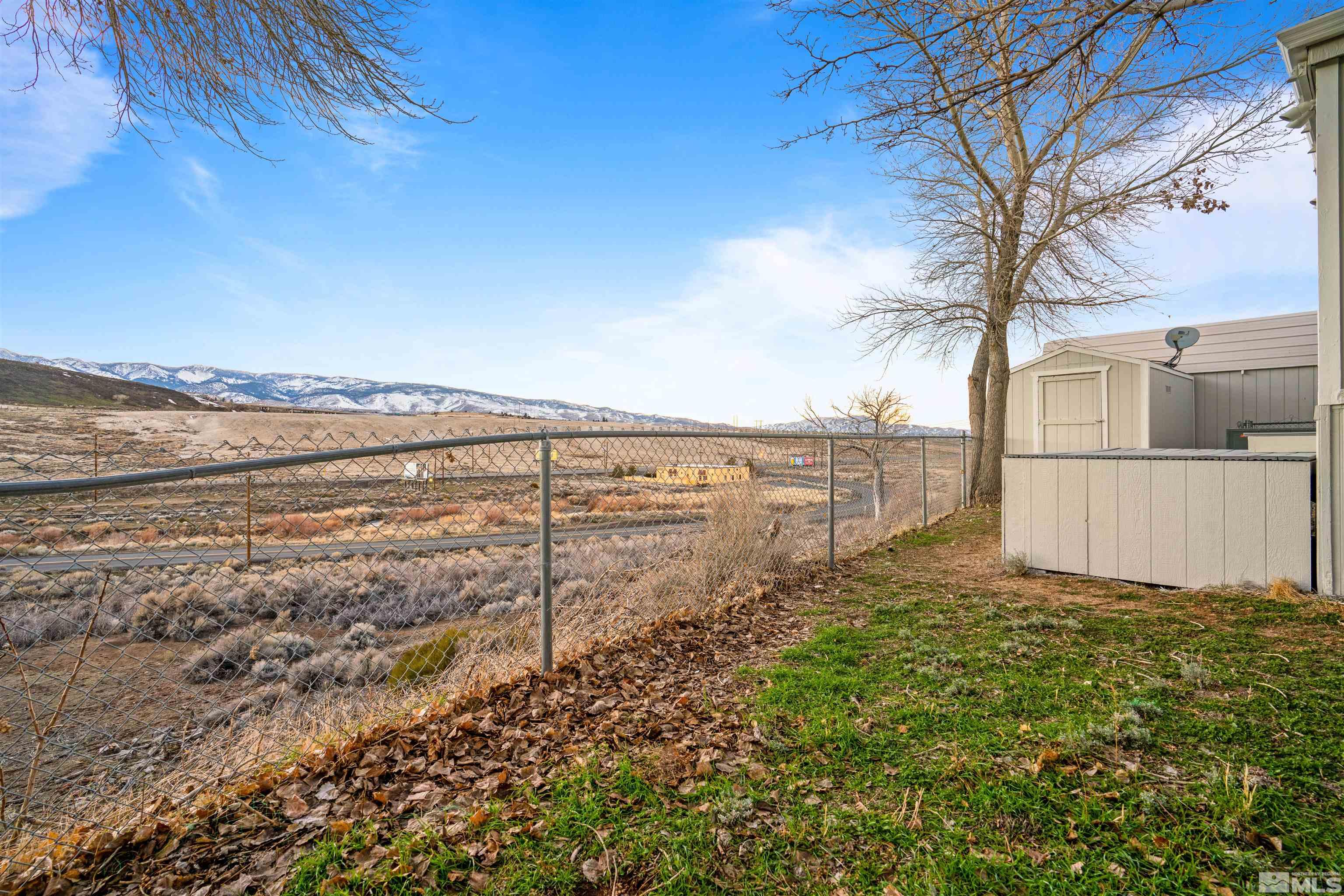 210 Zircon Drive Reno, NV 89521 - Photo 28 of 35 a view of a yard with an ocean view
