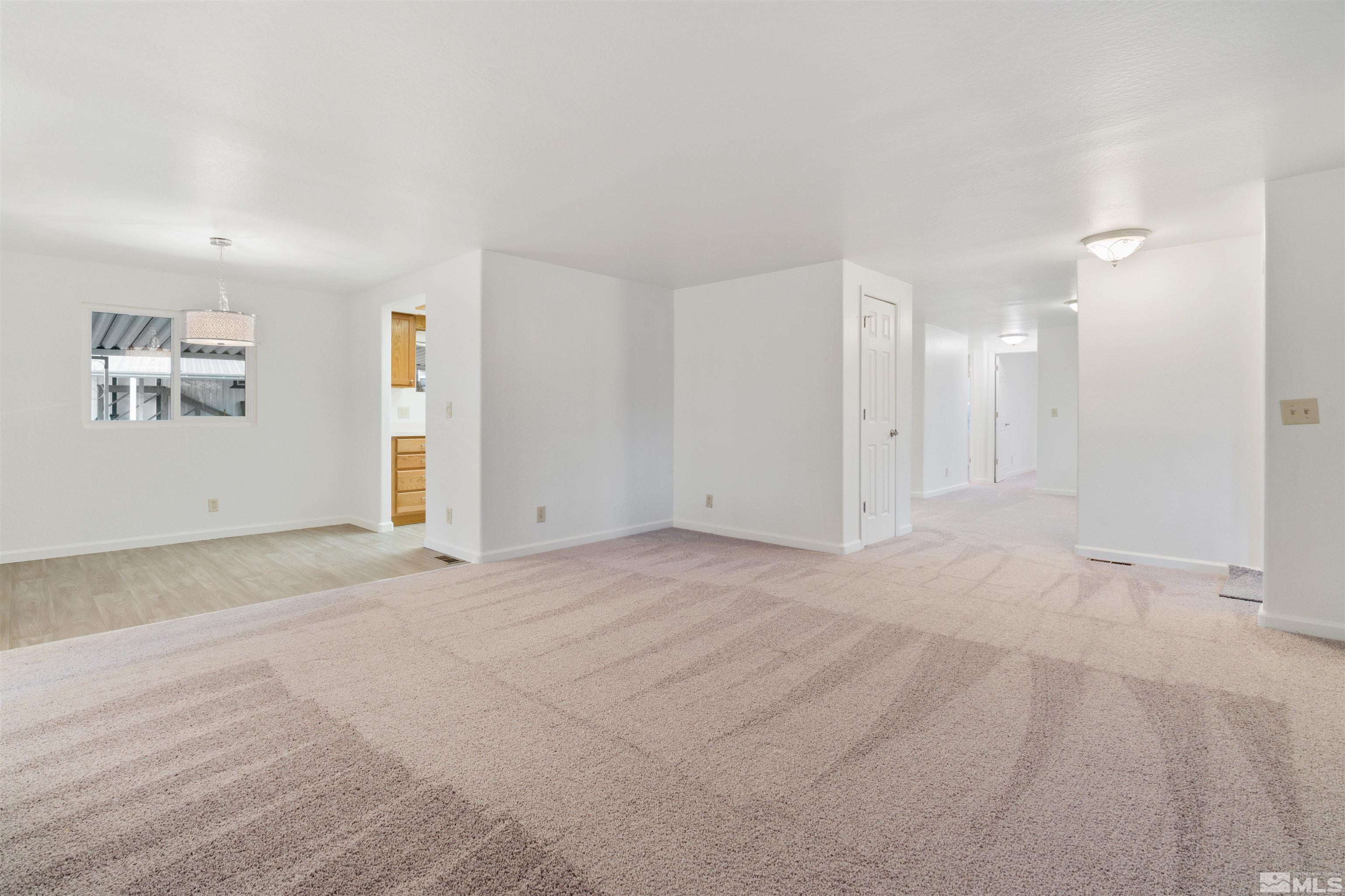 210 Zircon Drive Reno, NV 89521 - Photo 4 of 35 a view of an empty room with a window