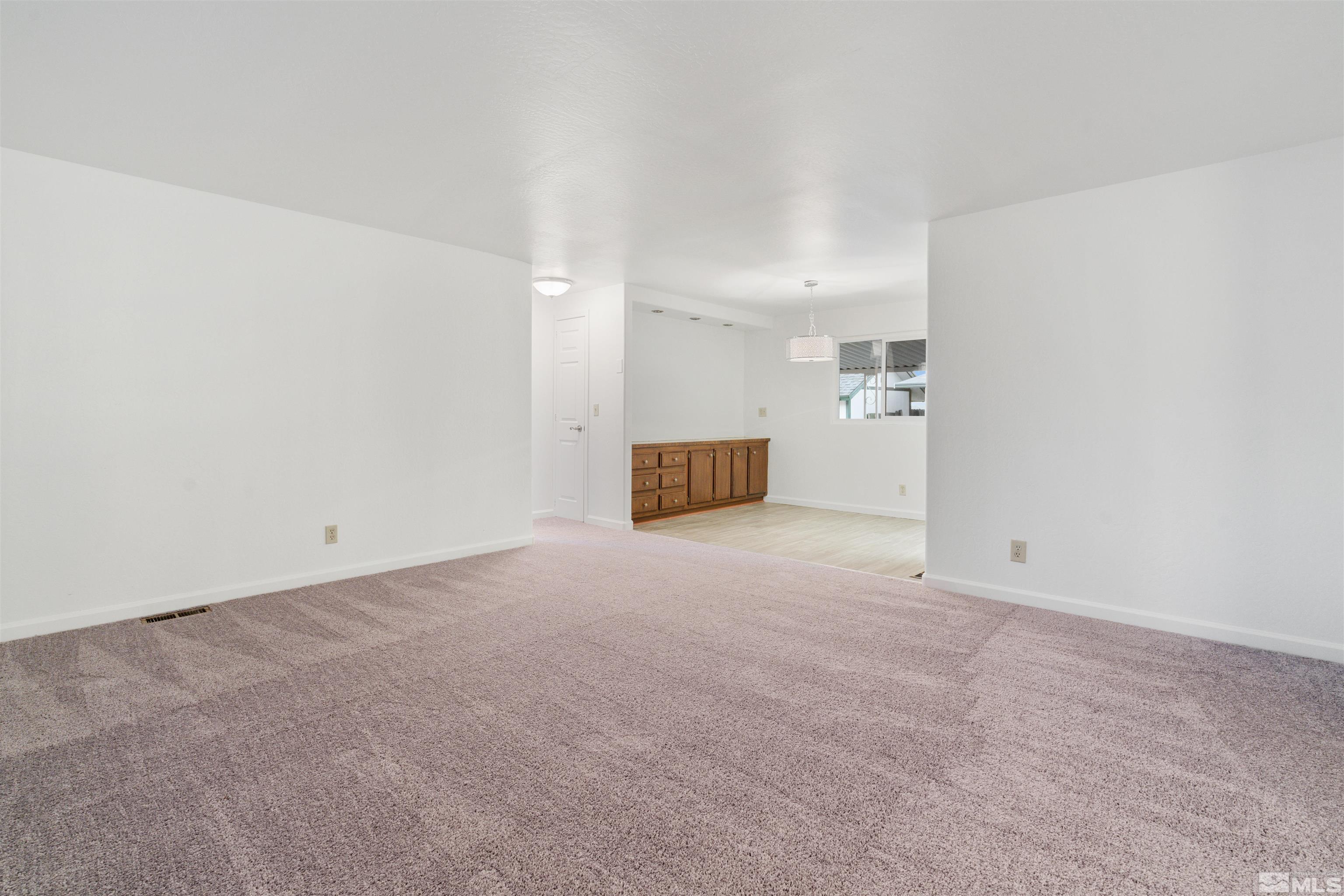 210 Zircon Drive Reno, NV 89521 - Photo 5 of 35 a view of a big room with an empty space