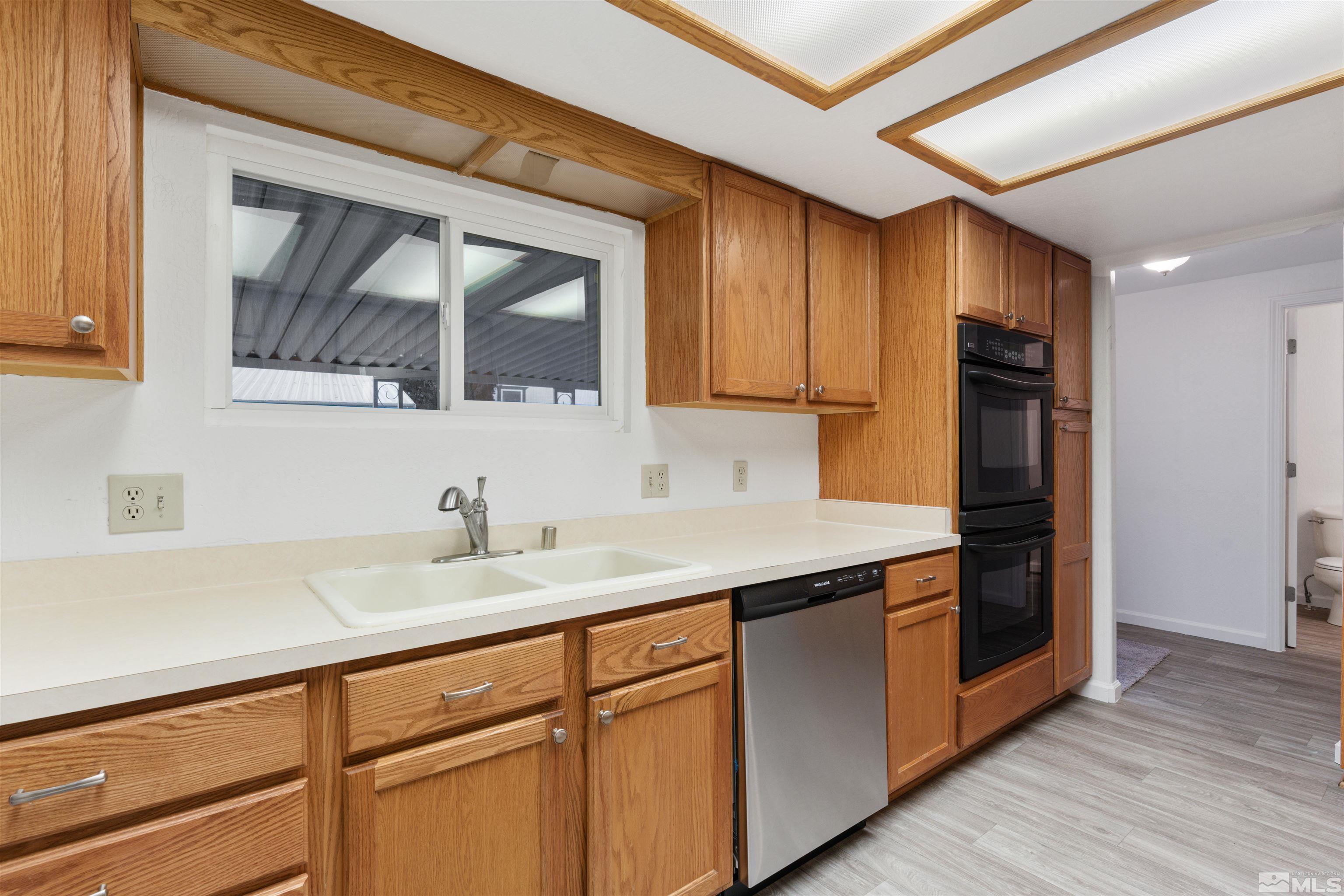210 Zircon Drive Reno, NV 89521 - Photo 6 of 35 a kitchen with a sink and cabinets