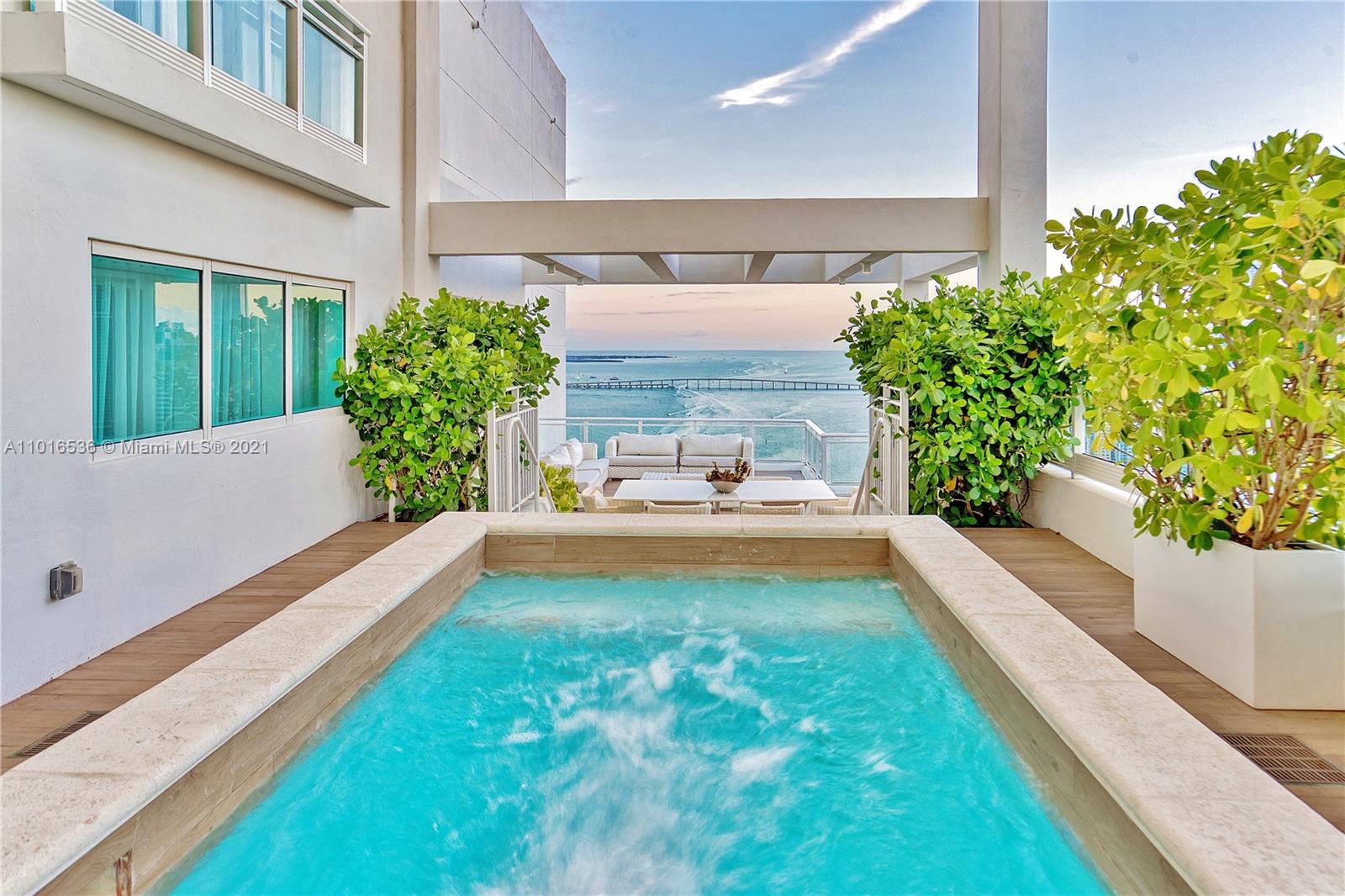900 Brickell Key Boulevard, Unit PH4 Miami, FL 33131 - Photo 1 of 79 a view of a bathtub in front of house