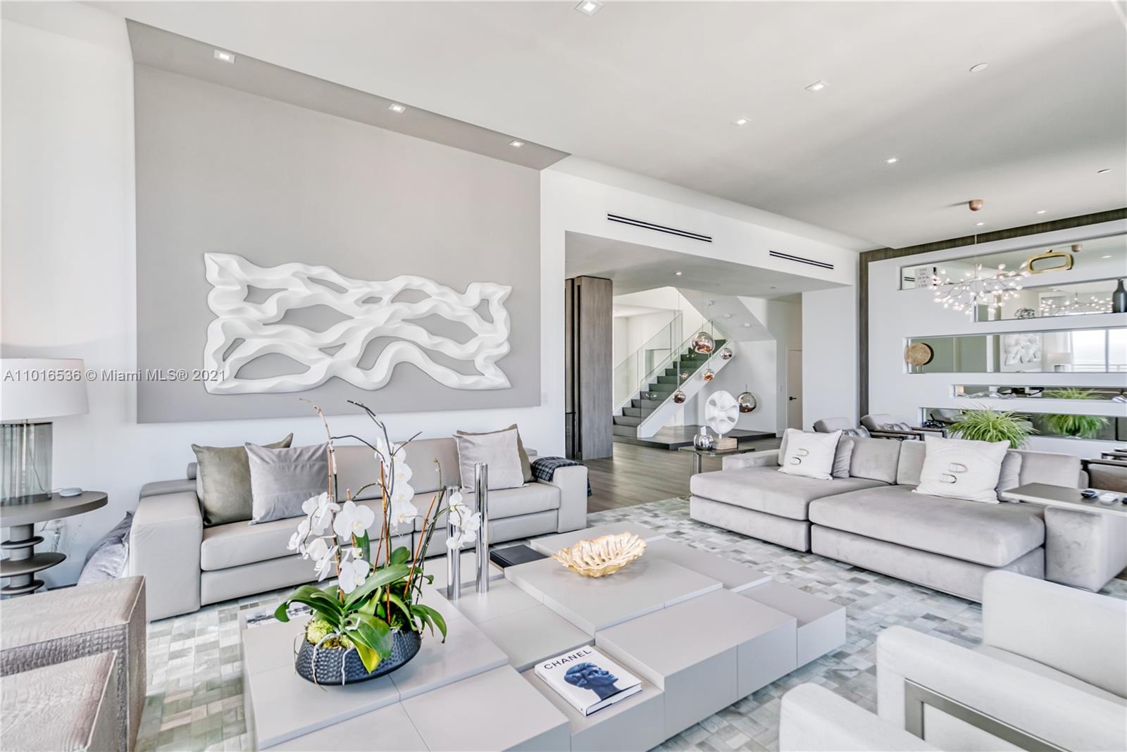 900 Brickell Key Boulevard, Unit PH4 Miami, FL 33131 - Photo 14 of 79 a living room with furniture and wooden floor