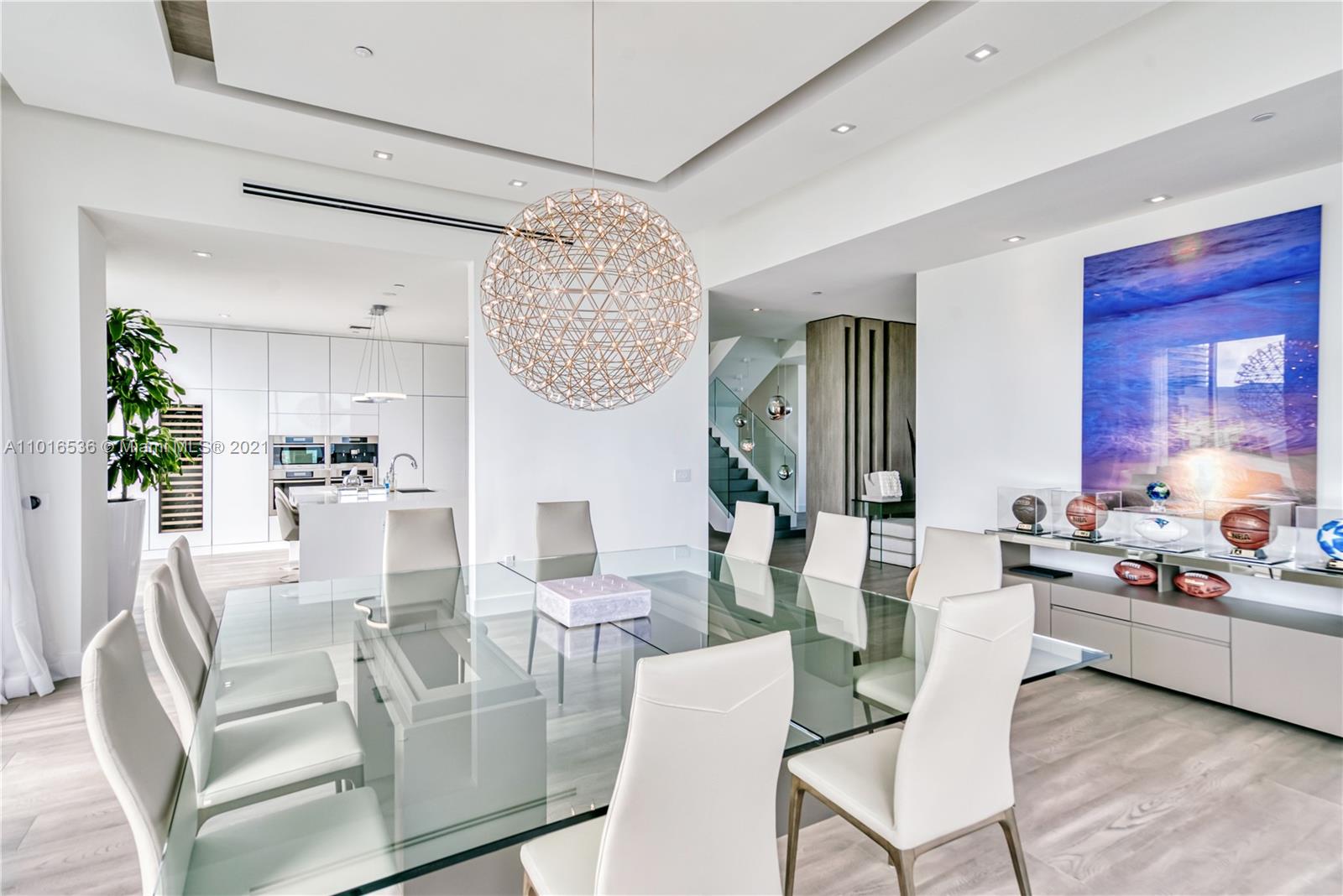 900 Brickell Key Boulevard, Unit PH4 Miami, FL 33131 - Photo 17 of 79 a view of a dining room with furniture