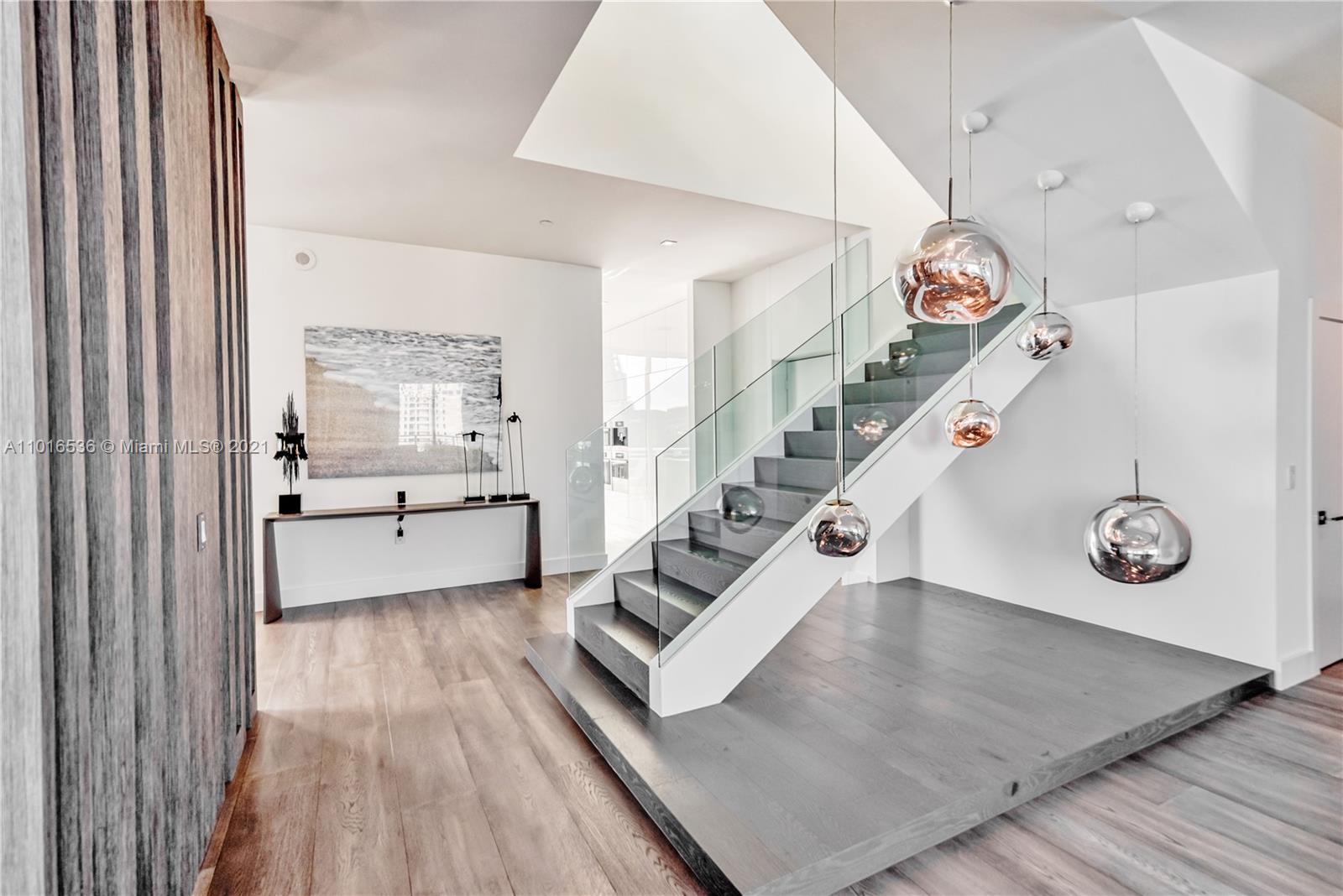 900 Brickell Key Boulevard, Unit PH4 Miami, FL 33131 - Photo 33 of 79 a view of an entryway with wooden floor