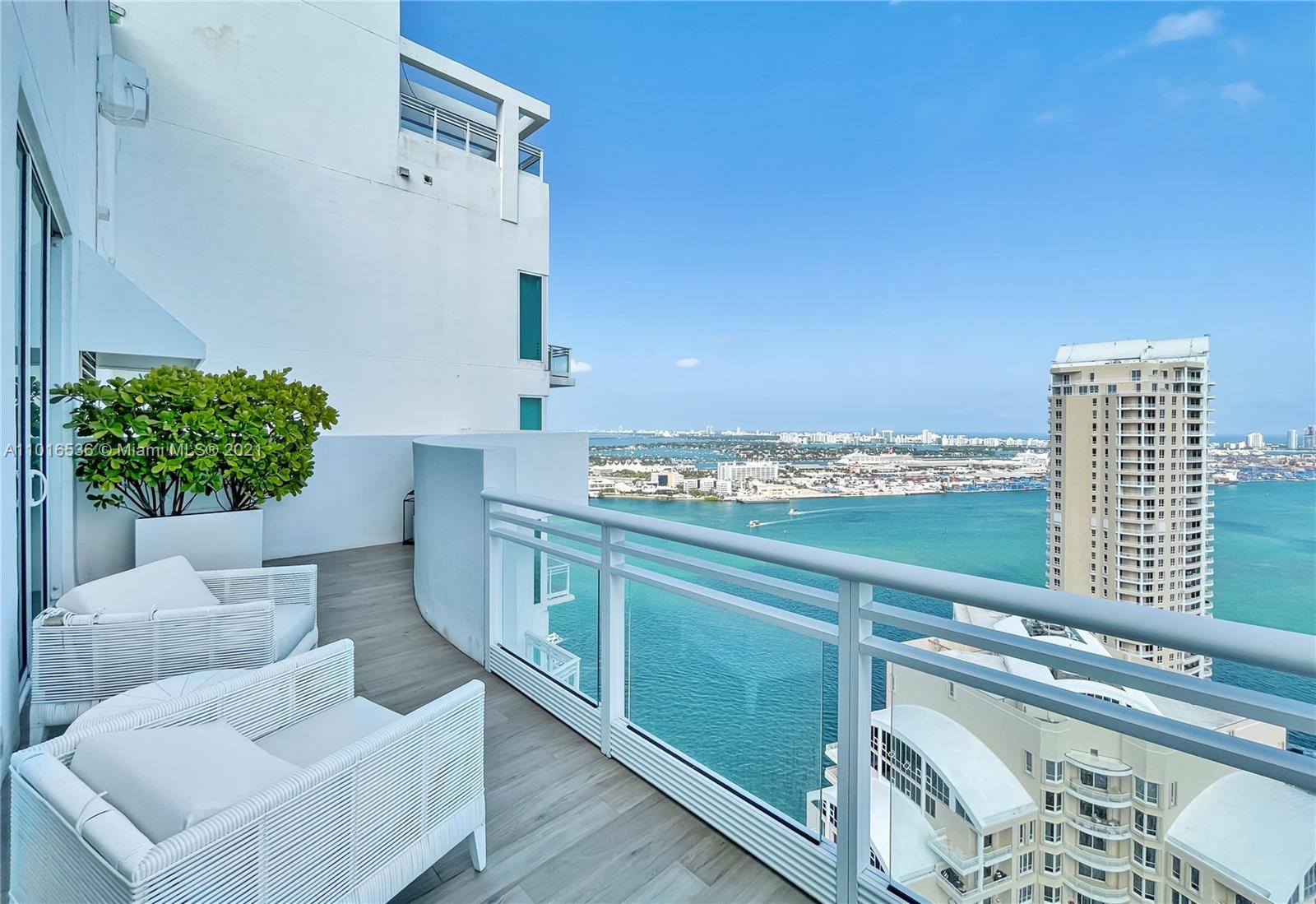 900 Brickell Key Boulevard, Unit PH4 Miami, FL 33131 - Photo 54 of 79 a view of kitchen and living room