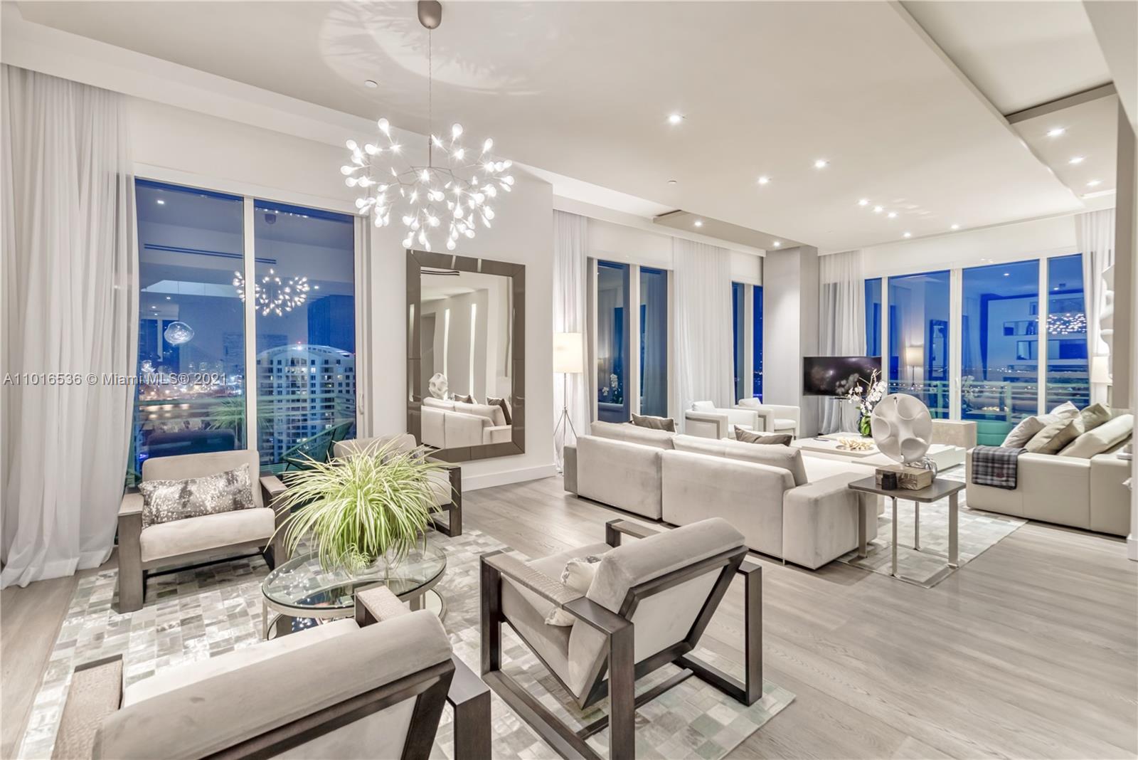 900 Brickell Key Boulevard, Unit PH4 Miami, FL 33131 - Photo 10 of 79 a living room with fireplace furniture and a chandelier