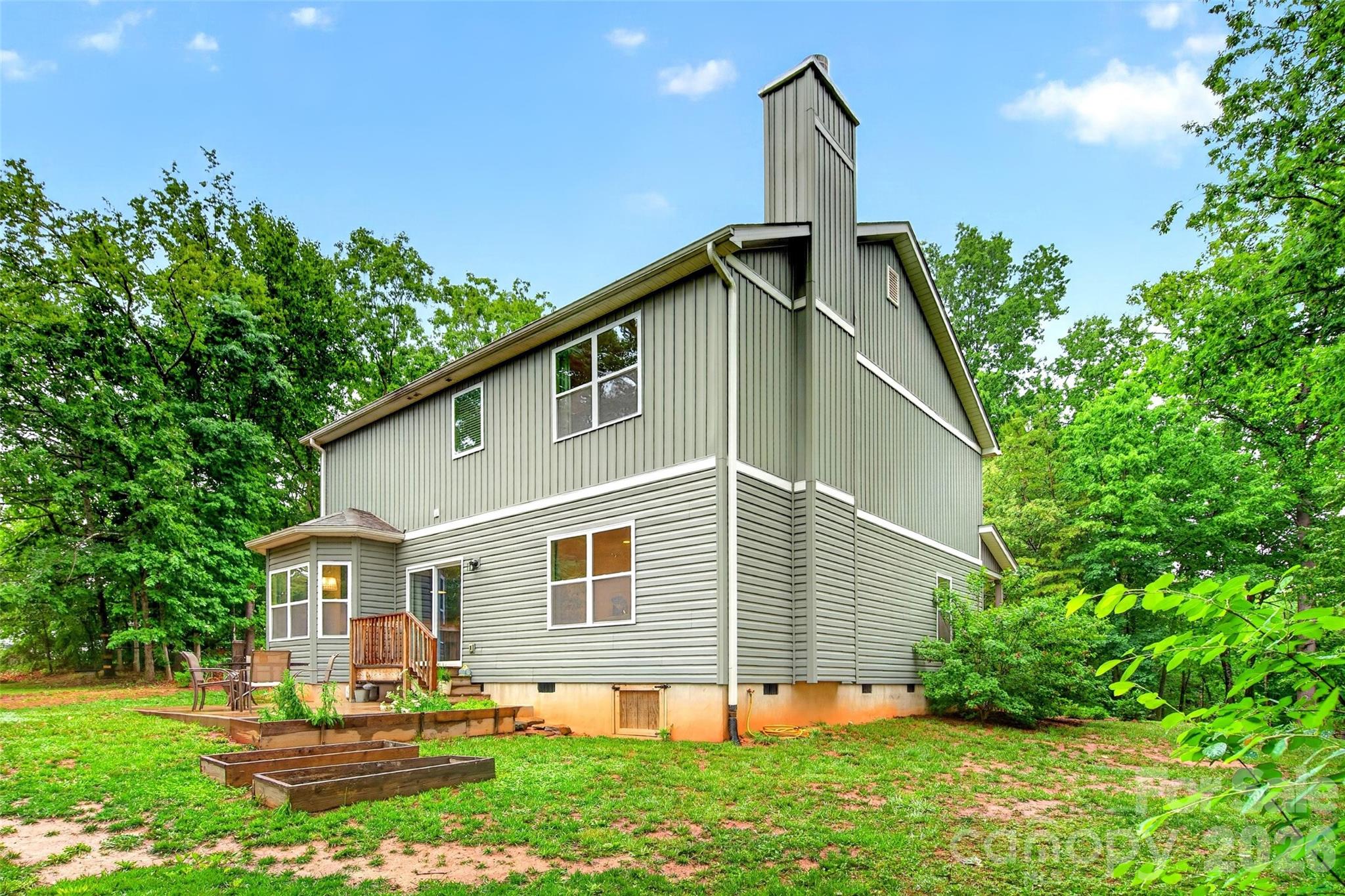 132 Maple Ridge Drive Old Fort, NC 28762 - Photo 4 of 40 a front view of house with a garden