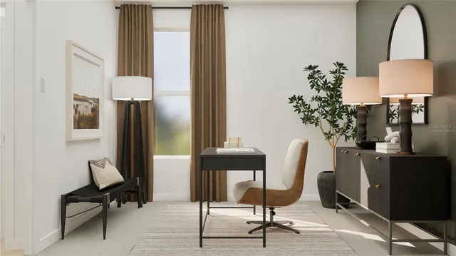 a view of a workspace with furniture and a potted plant