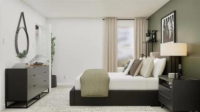 a bedroom with a bed and a mirror