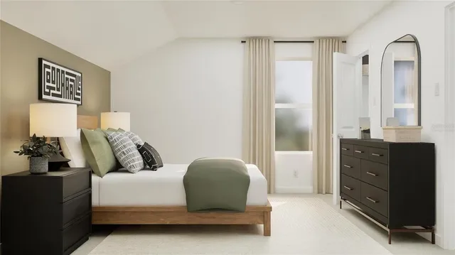 a bed room with a bed and a mirror