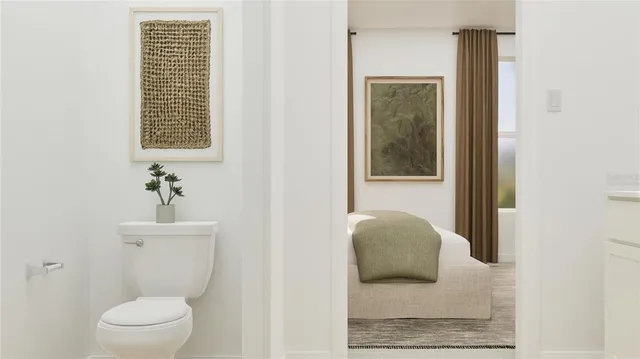 a bathroom with a toilet and a sink