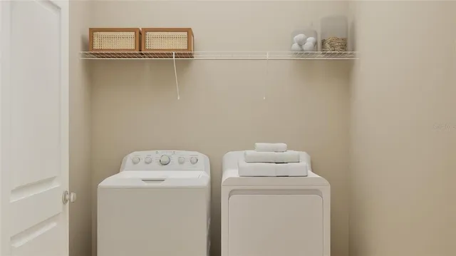 a utility room with dryer and washer
