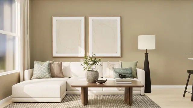 a living room with furniture and a lamp