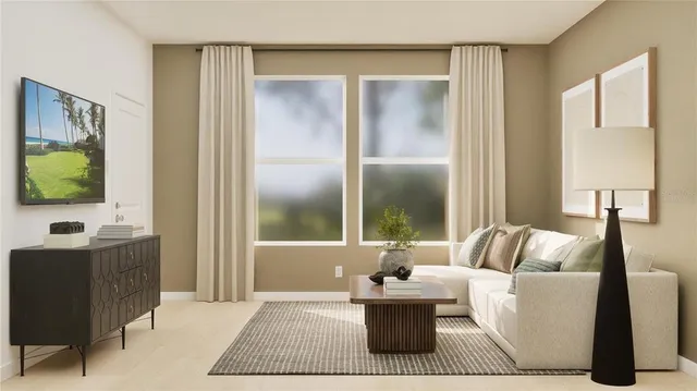 a living room with furniture and a window