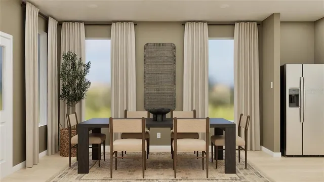 a view of a dining room with furniture and window