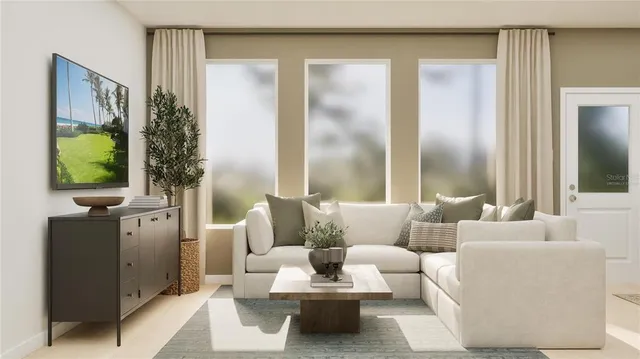 a living room with furniture and a flat screen tv