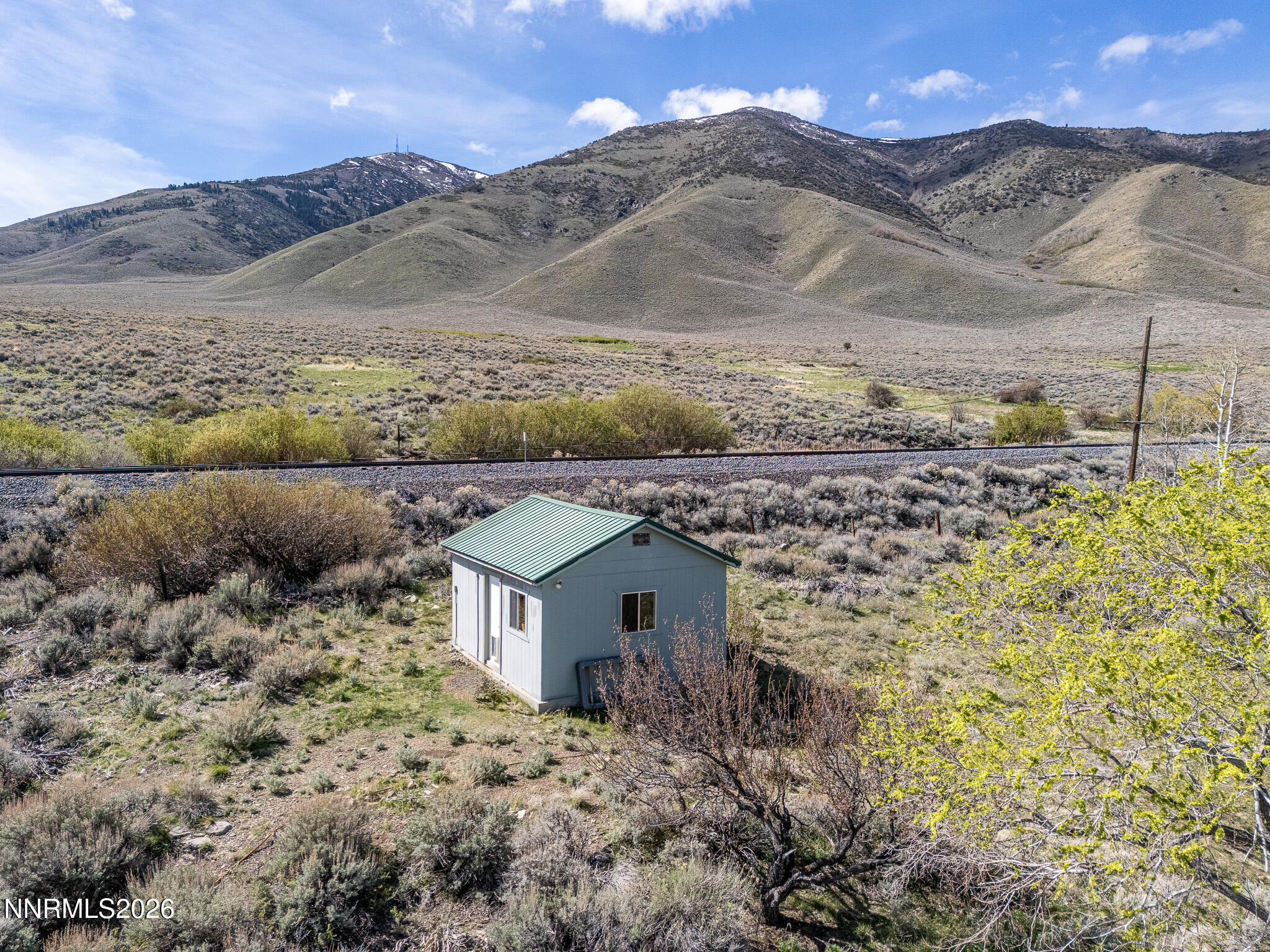 11000 Duffney Lane Reno, NV 89506 - Photo 18 of 24 a view of a stone house with a mountain