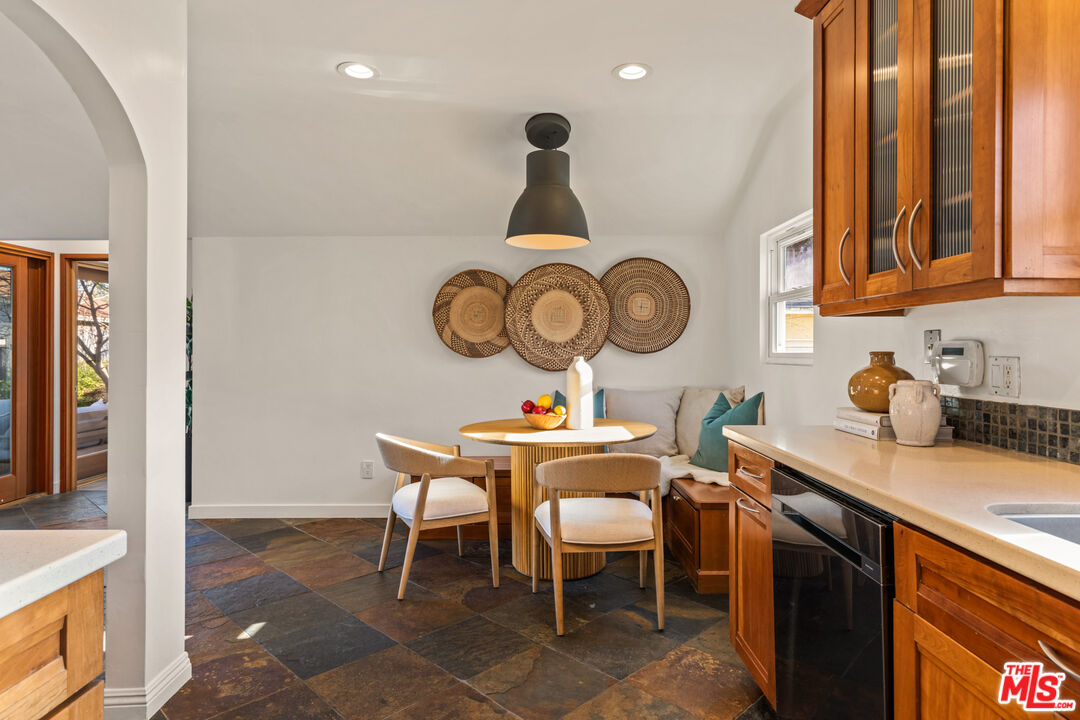 3344 Delaware Avenue Santa Monica, CA 90404 - Photo 11 of 28 a kitchen with a dining table and chairs