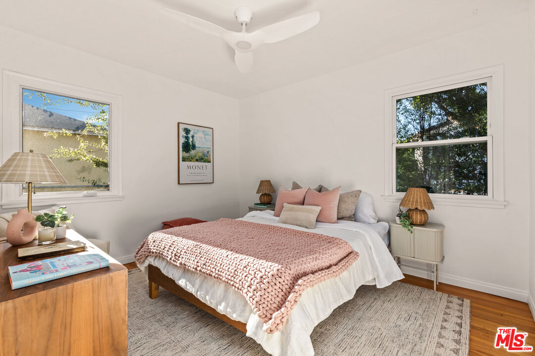 3344 Delaware Avenue Santa Monica, CA 90404 - Photo 23 of 28 a bedroom with a bed a mirror and a window