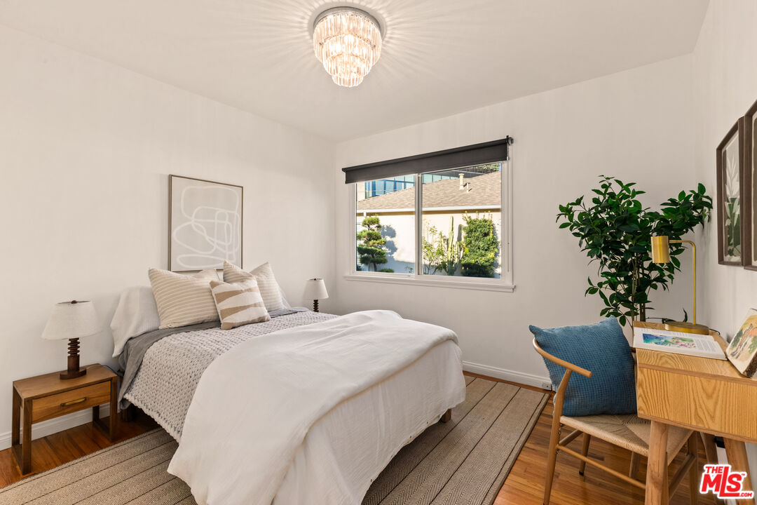 3344 Delaware Avenue Santa Monica, CA 90404 - Photo 24 of 28 a bedroom with a bed and a potted plant