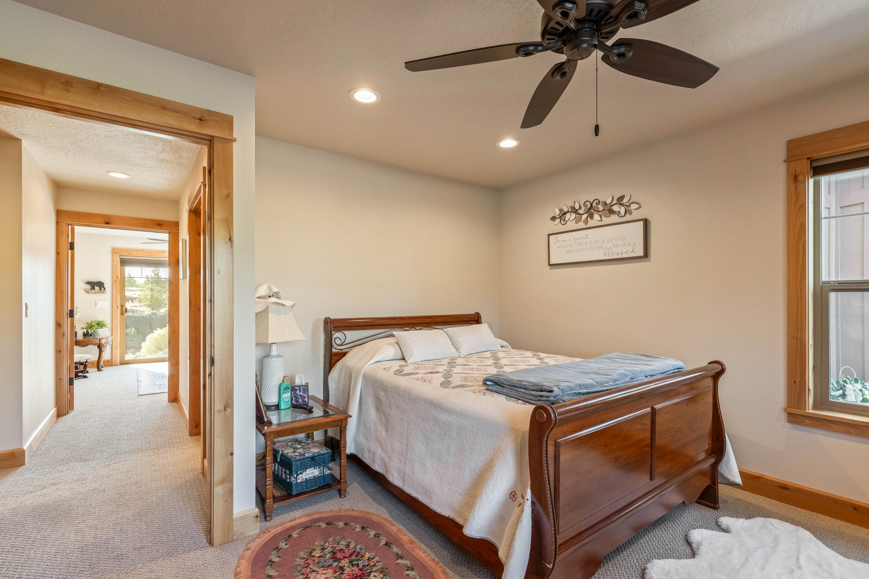 70030 Northwest Hunt Road Sisters, OR 97759 - Photo 22 of 55 a bed room with a bed and a chandelier