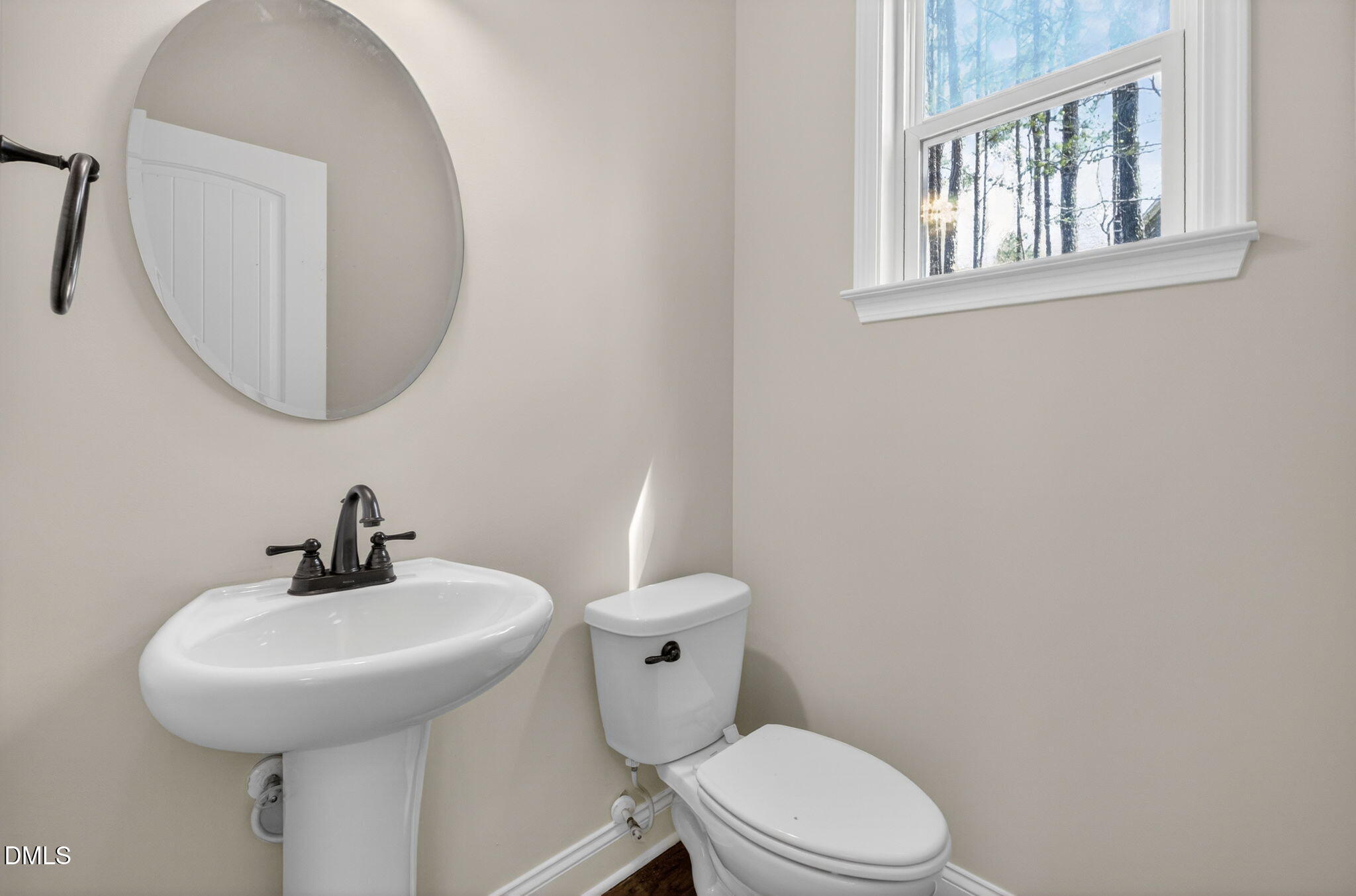 1304 Barnford Mill Road Wake Forest, NC 27587 - Photo 16 of 44 a bathroom with a toilet a sink and a mirror