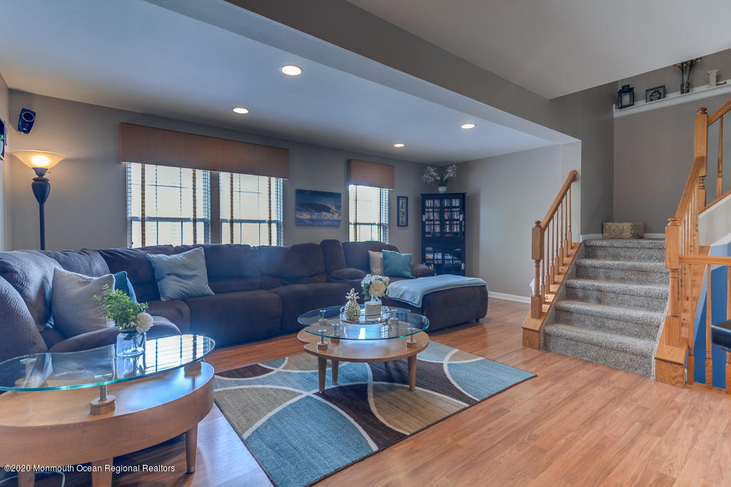 55 Saxton Road Farmingdale, NJ 07727 - Photo 11 of 23 a living room with furniture potted plant and a window