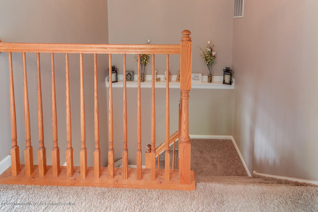 55 Saxton Road Farmingdale, NJ 07727 - Photo 14 of 23 a view of wooden floor with staircase