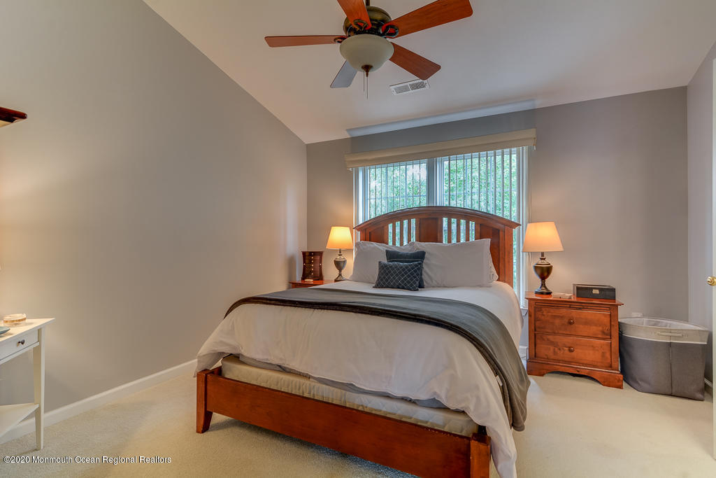 55 Saxton Road Farmingdale, NJ 07727 - Photo 15 of 23 a bedroom with a bed and window