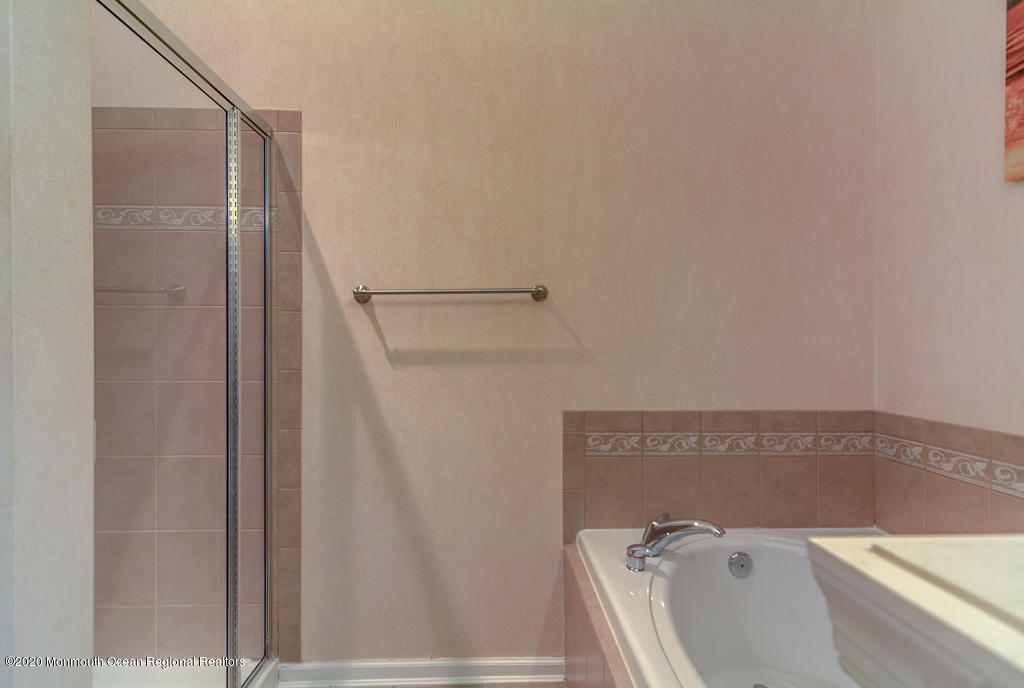 55 Saxton Road Farmingdale, NJ 07727 - Photo 18 of 23 a bathroom with a tub and shower
