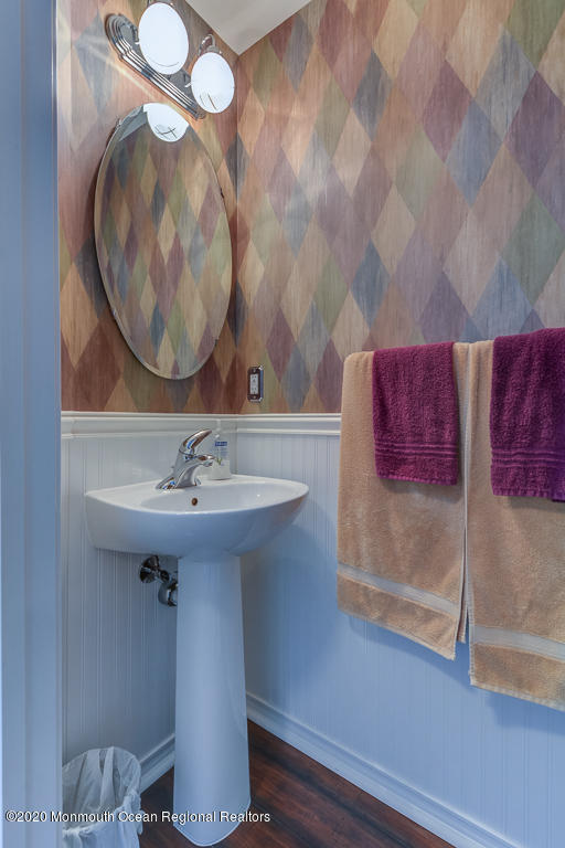 55 Saxton Road Farmingdale, NJ 07727 - Photo 3 of 23 a bathroom with a sink and a mirror