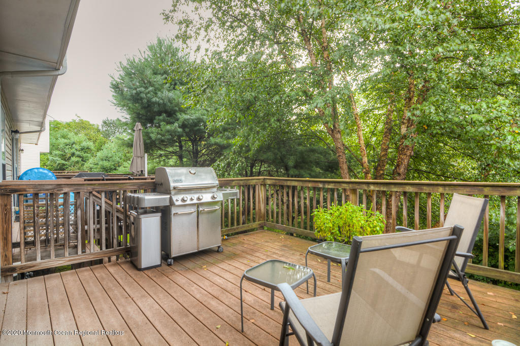 55 Saxton Road Farmingdale, NJ 07727 - Photo 22 of 23 a view of a chair and table on the wooden floor