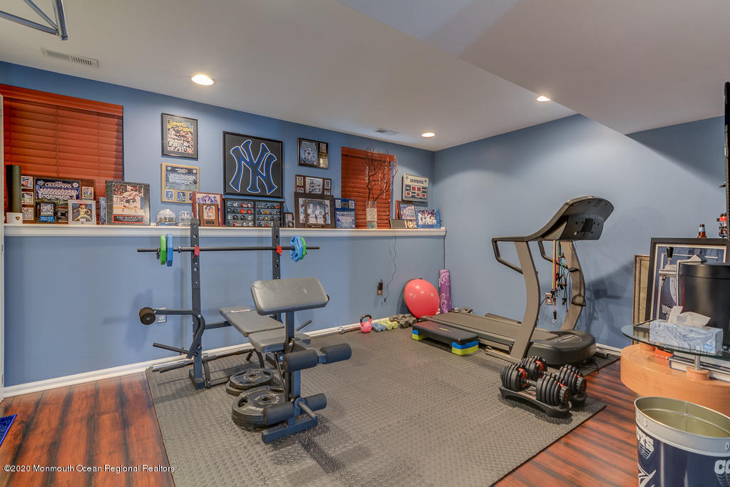 55 Saxton Road Farmingdale, NJ 07727 - Photo 4 of 23 a room with furniture and gym equipment