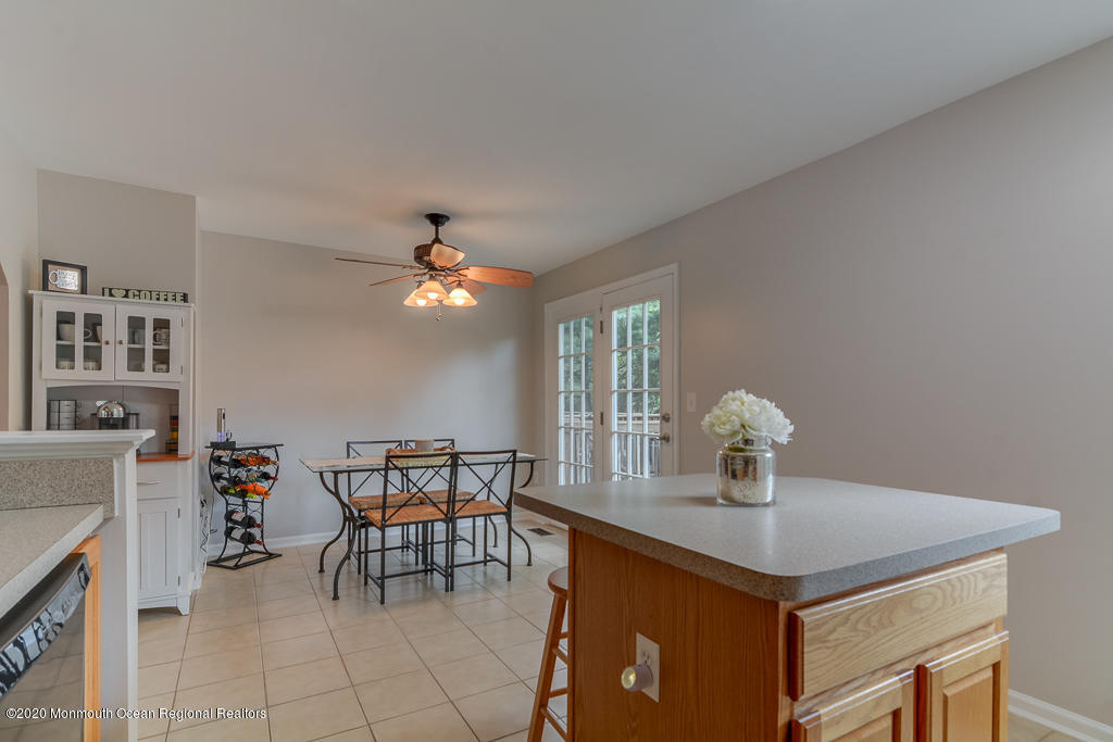 55 Saxton Road Farmingdale, NJ 07727 - Photo 9 of 23 a view of a dining room with furniture and chandelier