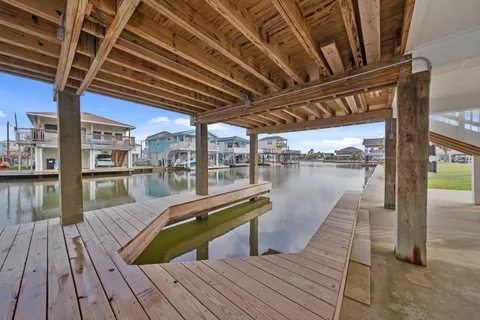 a view of a balcony with wooden floor