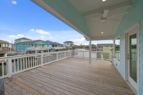 a view of a balcony with wooden floor