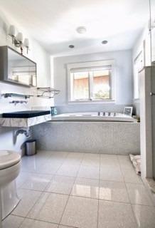 7 Erlinda Road Truro, MA 02666 - Photo 13 of 19 a spacious bathroom with a tub a sink and a mirror