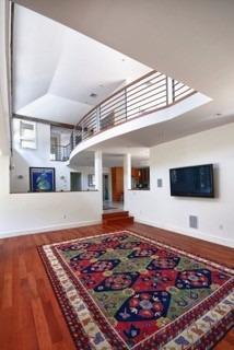 7 Erlinda Road Truro, MA 02666 - Photo 10 of 19 a living room with kitchen rug and a flat screen tv