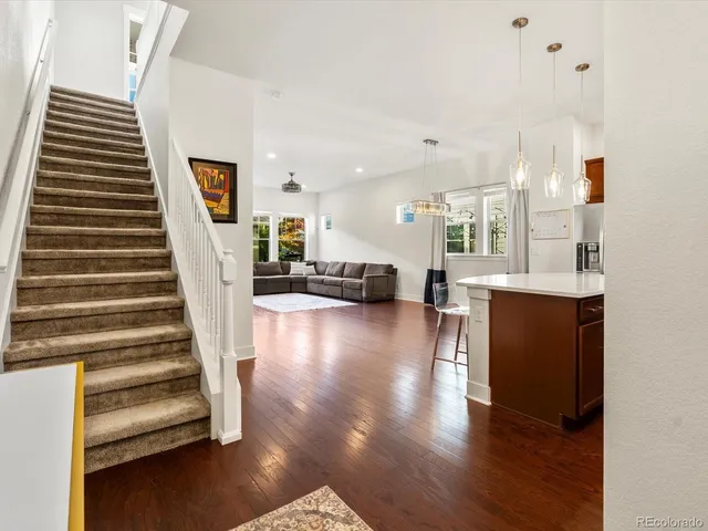 a en suite bathroom with a granite countertop sink and a mirror
