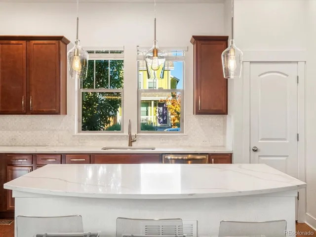 a view of a living room with furniture and wooden floor